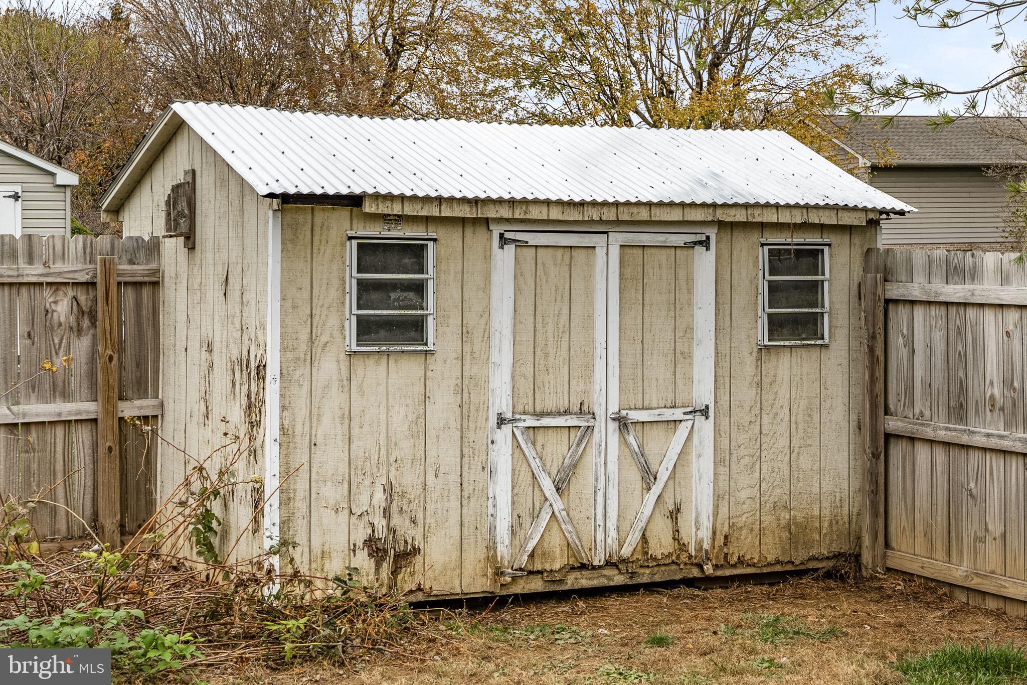 119 Harristown Road Paradise, PA 17562 - Photo 8 of 25 a front view of a house with a garden