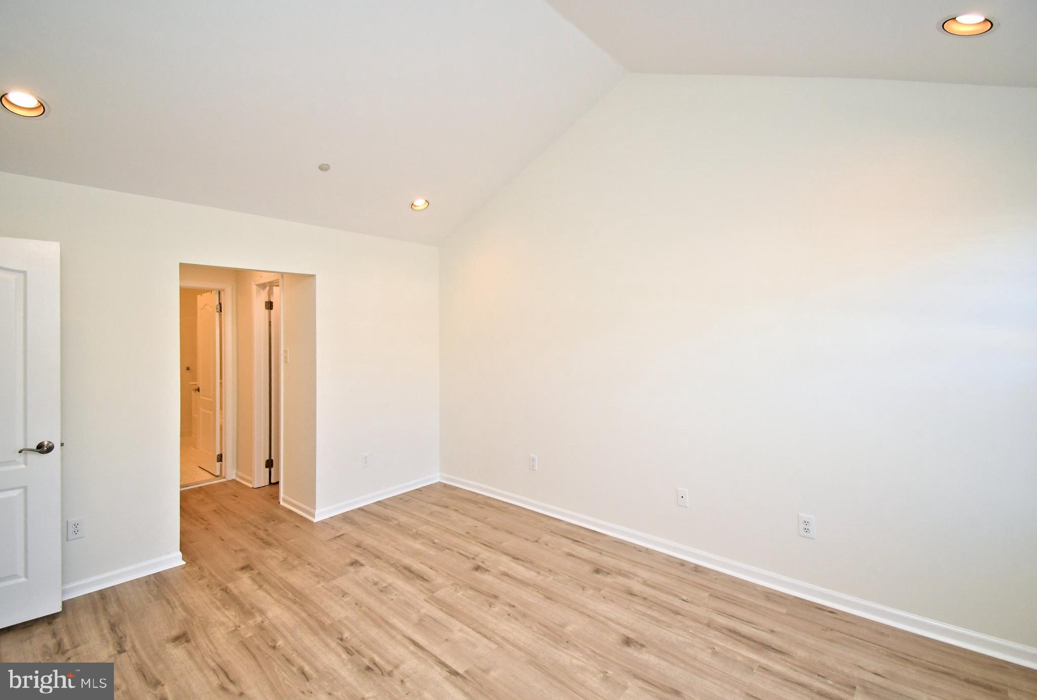 235 Valley Forge Lookout Place Wayne, PA 19087 - Photo 14 of 24 Spacious room with vaulted ceiling charm.