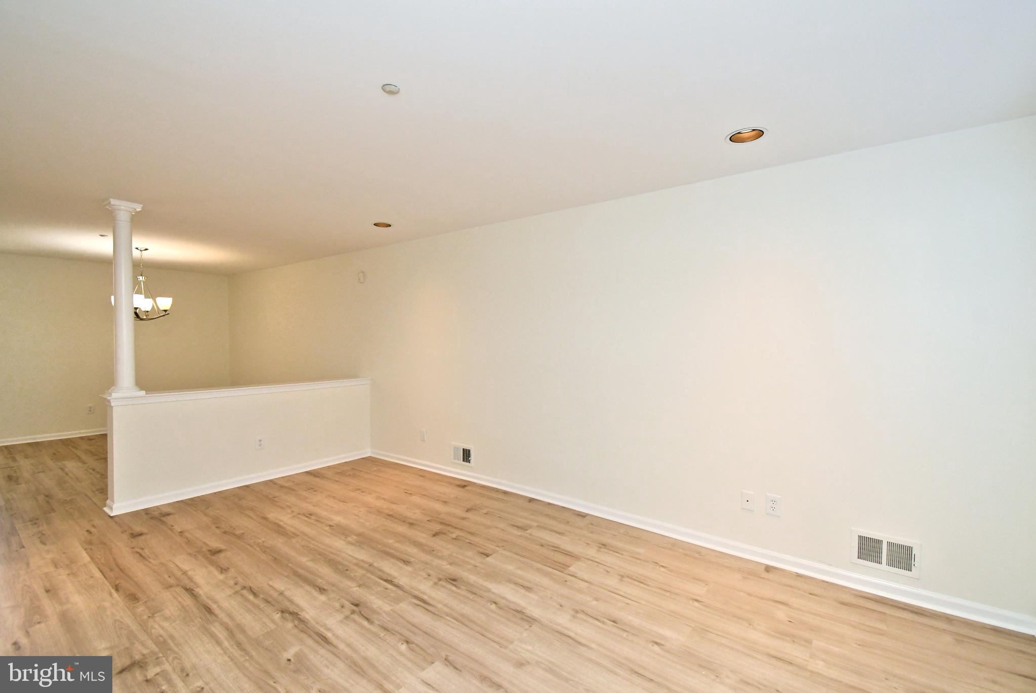 235 Valley Forge Lookout Place Wayne, PA 19087 - Photo 4 of 24 Spacious, light-filled living area awaits you.