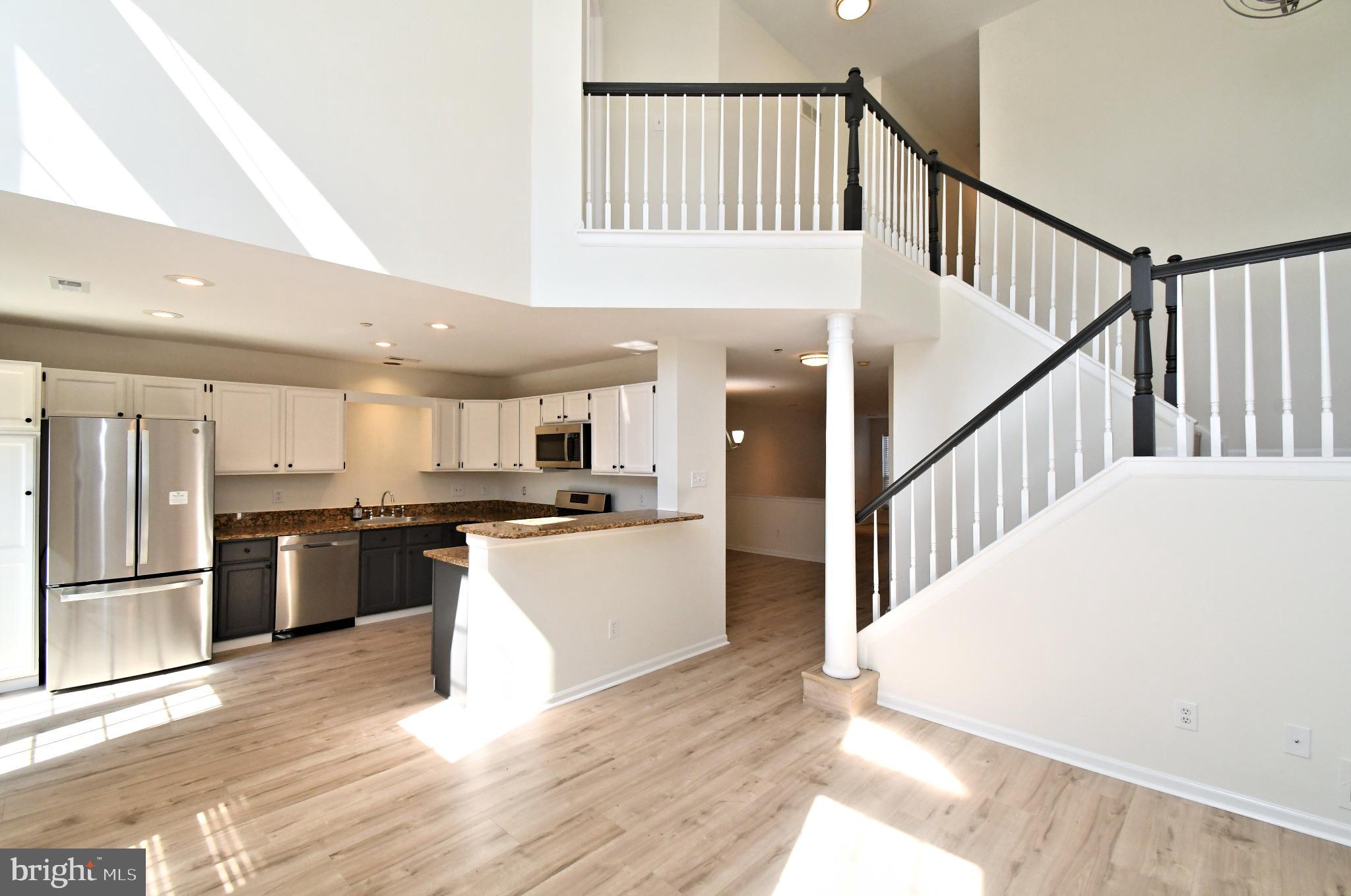 235 Valley Forge Lookout Place Wayne, PA 19087 - Photo 9 of 24 Spacious, sunlit open-concept living area.