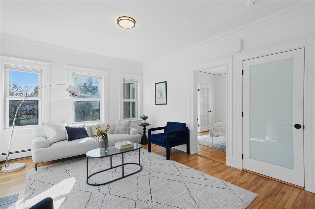 25 Spruce Street, Unit 25 Watertown, MA 02472 - Photo 14 of 39 a living room with furniture and a table
