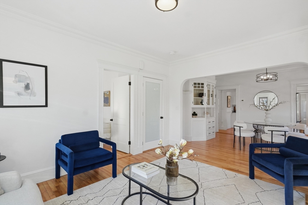 25 Spruce Street, Unit 25 Watertown, MA 02472 - Photo 17 of 39 a living room with furniture and a clock
