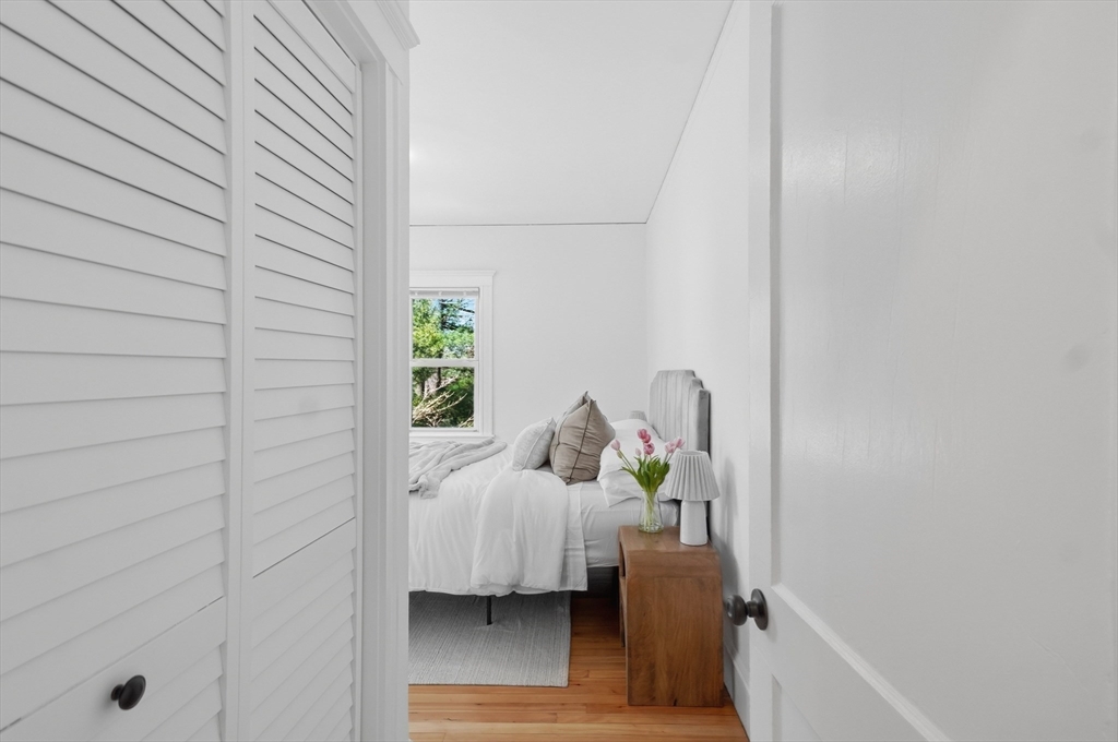 25 Spruce Street, Unit 25 Watertown, MA 02472 - Photo 18 of 39 a bedroom with a bed and a window