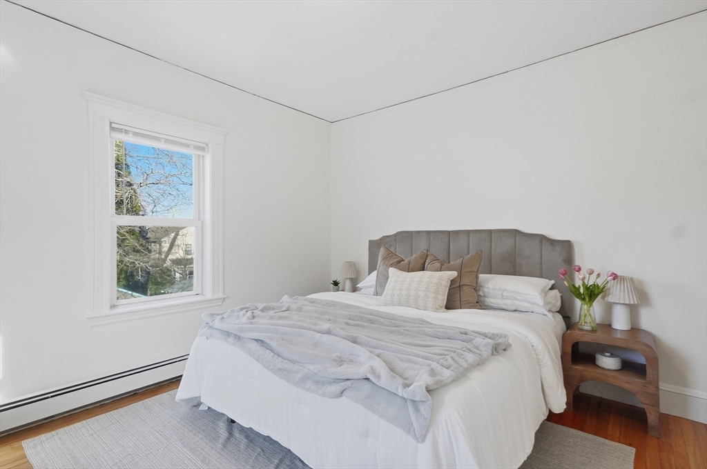 25 Spruce Street, Unit 25 Watertown, MA 02472 - Photo 19 of 39 a bedroom with a bed and a window