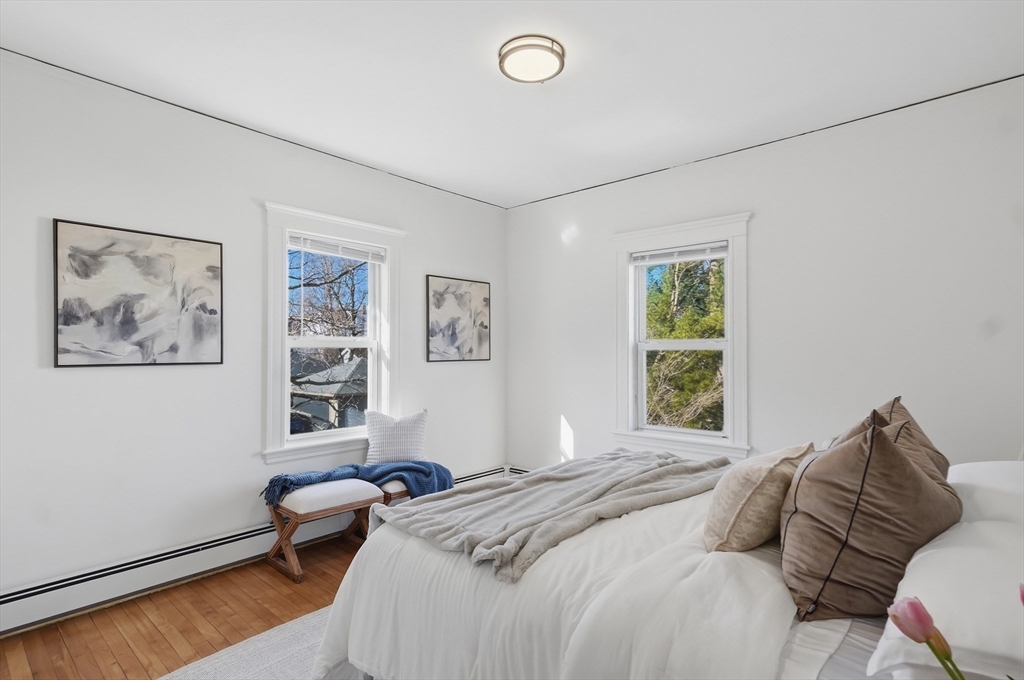 25 Spruce Street, Unit 25 Watertown, MA 02472 - Photo 20 of 39 a bedroom with a bed couch and a window