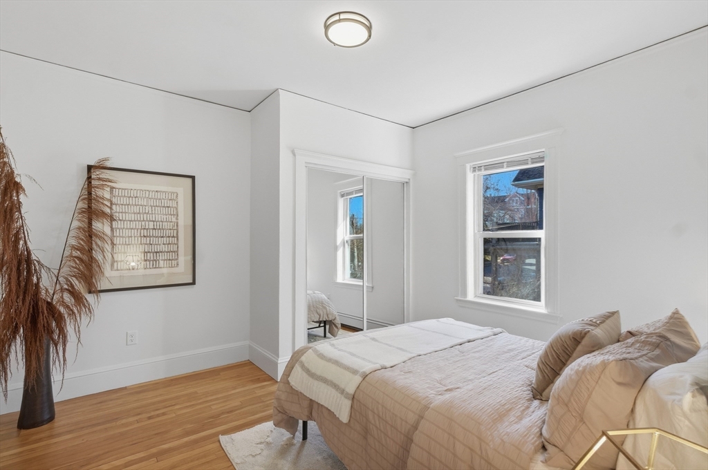 25 Spruce Street, Unit 25 Watertown, MA 02472 - Photo 21 of 39 a bedroom with a bed and a window