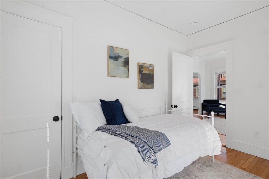 25 Spruce Street, Unit 25 Watertown, MA 02472 - Photo 25 of 39 a bedroom with a bed and a closet