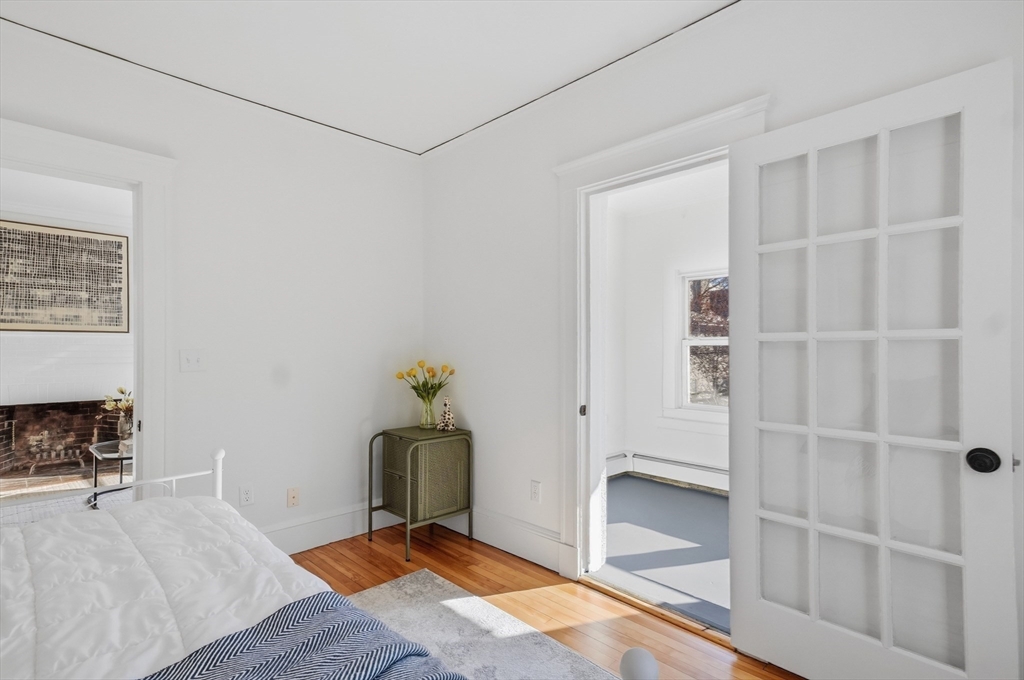 25 Spruce Street, Unit 25 Watertown, MA 02472 - Photo 26 of 39 a workspace with wooden floor and windows