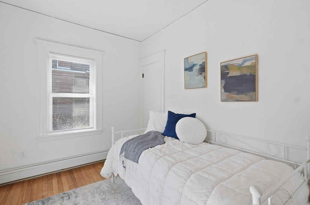 25 Spruce Street, Unit 25 Watertown, MA 02472 - Photo 27 of 39 a bedroom with a bed and a window