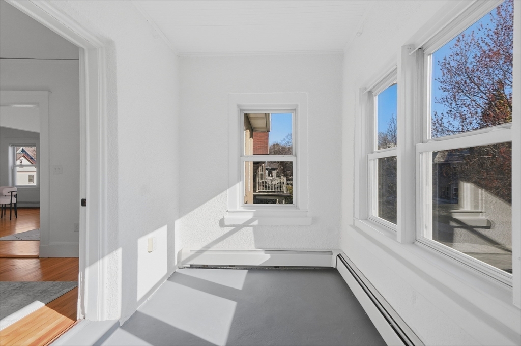 25 Spruce Street, Unit 25 Watertown, MA 02472 - Photo 29 of 39 a view of an entryway with wooden floor and a rug