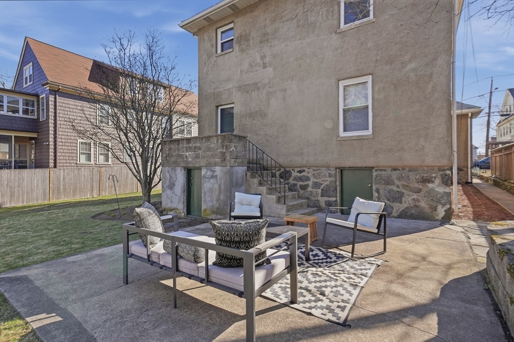 25 Spruce Street, Unit 25 Watertown, MA 02472 - Photo 31 of 39 a view of a patio with a table and chairs