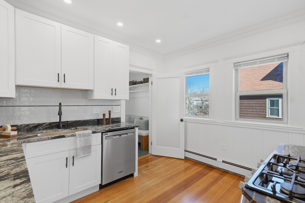 25 Spruce Street, Unit 25 Watertown, MA 02472 - Photo 7 of 39 a kitchen with a sink stove and cabinets