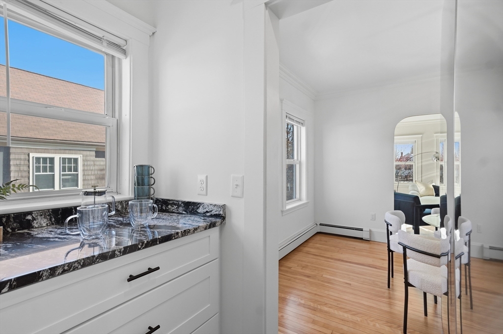 25 Spruce Street, Unit 25 Watertown, MA 02472 - Photo 9 of 39 a bathroom with granite countertop a sink and a granite counter tops