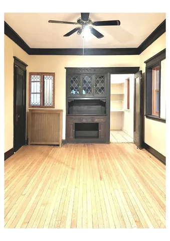 a kitchen with granite countertop a stove a sink and a microwave