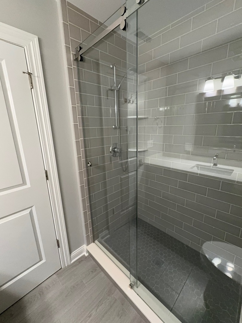 740 Chestnut Street, Unit 2 Deerfield, IL 60015 - Photo 5 of 11 a bathroom with a shower