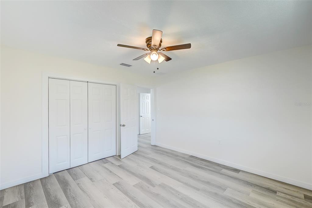 4867 East Riverside Drive Fort Myers, FL 33905 - Photo 23 of 45 wooden floor in an empty room