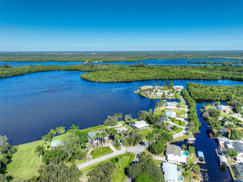 4867 East Riverside Drive Fort Myers, FL 33905 - Photo 38 of 45 a view of a lake with a building in the background
