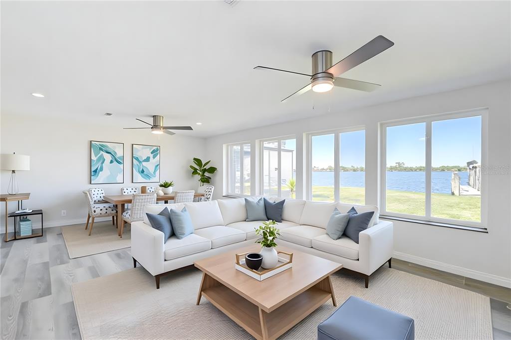 4867 East Riverside Drive Fort Myers, FL 33905 - Photo 8 of 45 a living room with furniture and a large window