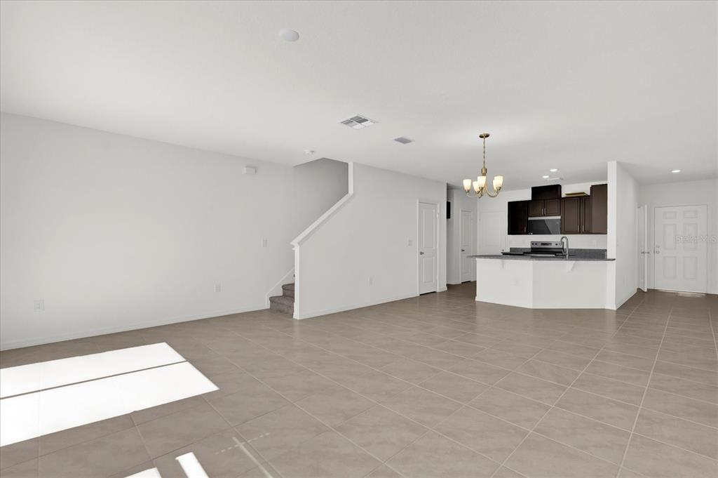 375 Sequoia Drive Lake Wales, FL 33859 - Photo 2 of 16 a view of a kitchen with a sink and a refrigerator