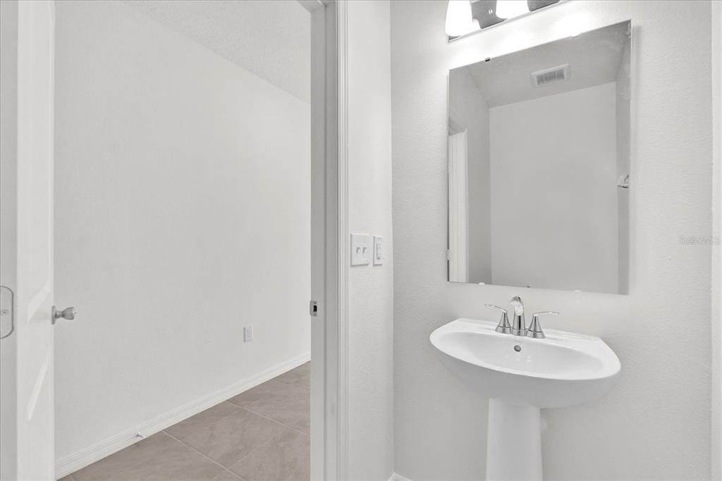 375 Sequoia Drive Lake Wales, FL 33859 - Photo 6 of 16 a bathroom with a sink and a mirror