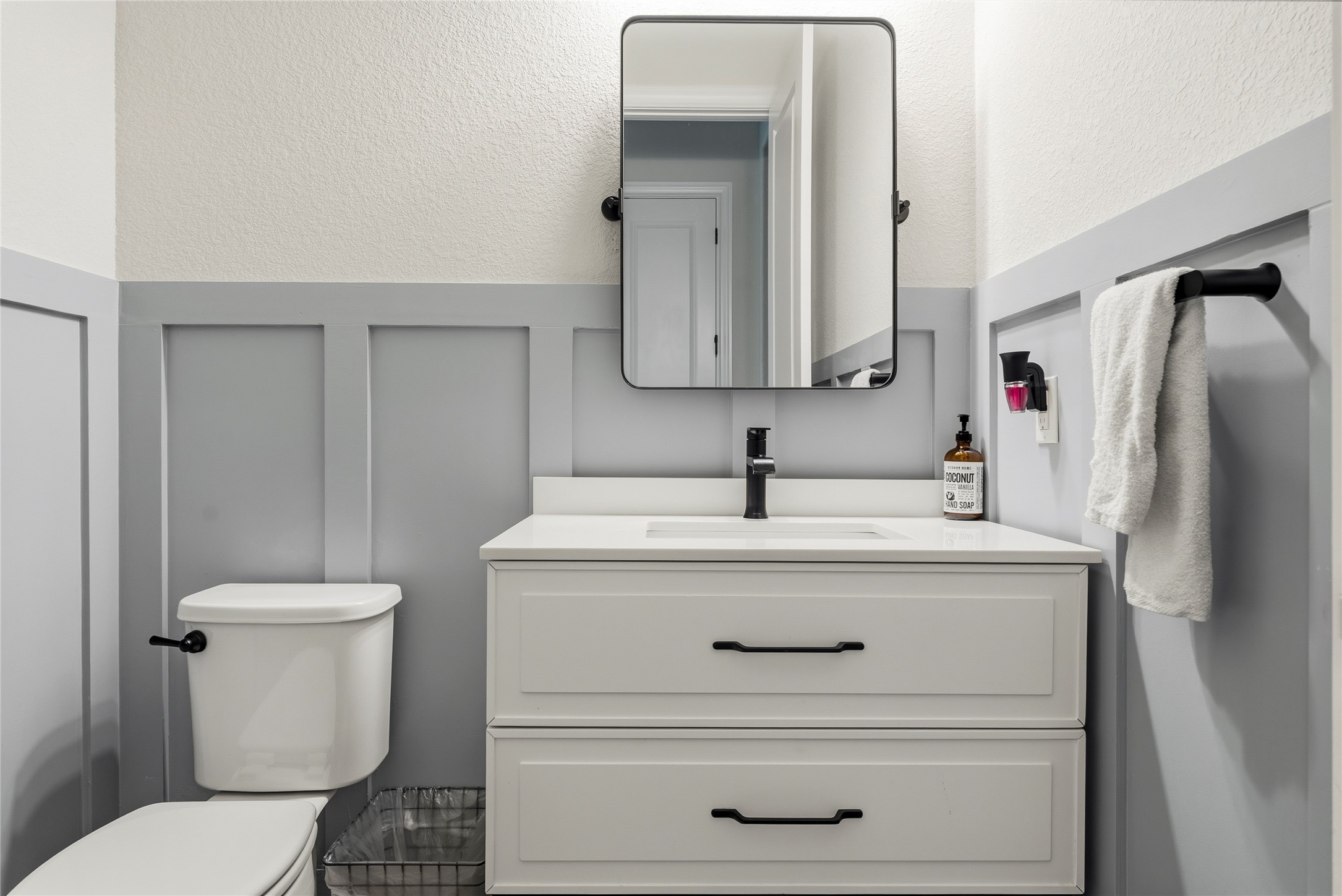 4513 Vieste View Leander, TX 78641 - Photo 33 of 40 Contemporary bathroom vanity featuring a white countertop, undermount sink, and matte black faucet