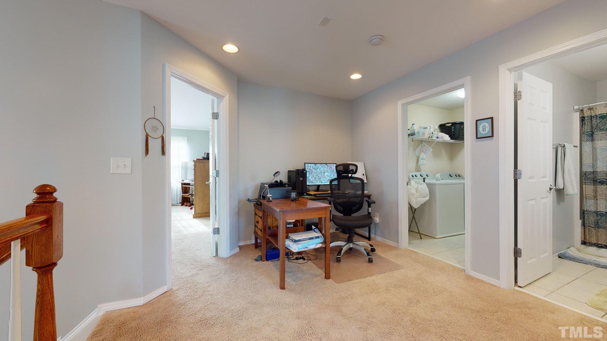 8405 Stoneyard Place Raleigh, NC 27613 - Photo 14 of 24 a workspace with furniture and a gate
