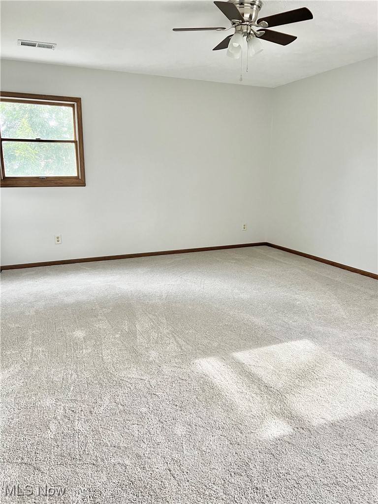 15317 Strader Road East Liverpool, OH 43920 - Photo 19 of 23 Empty room featuring carpet and ceiling fan