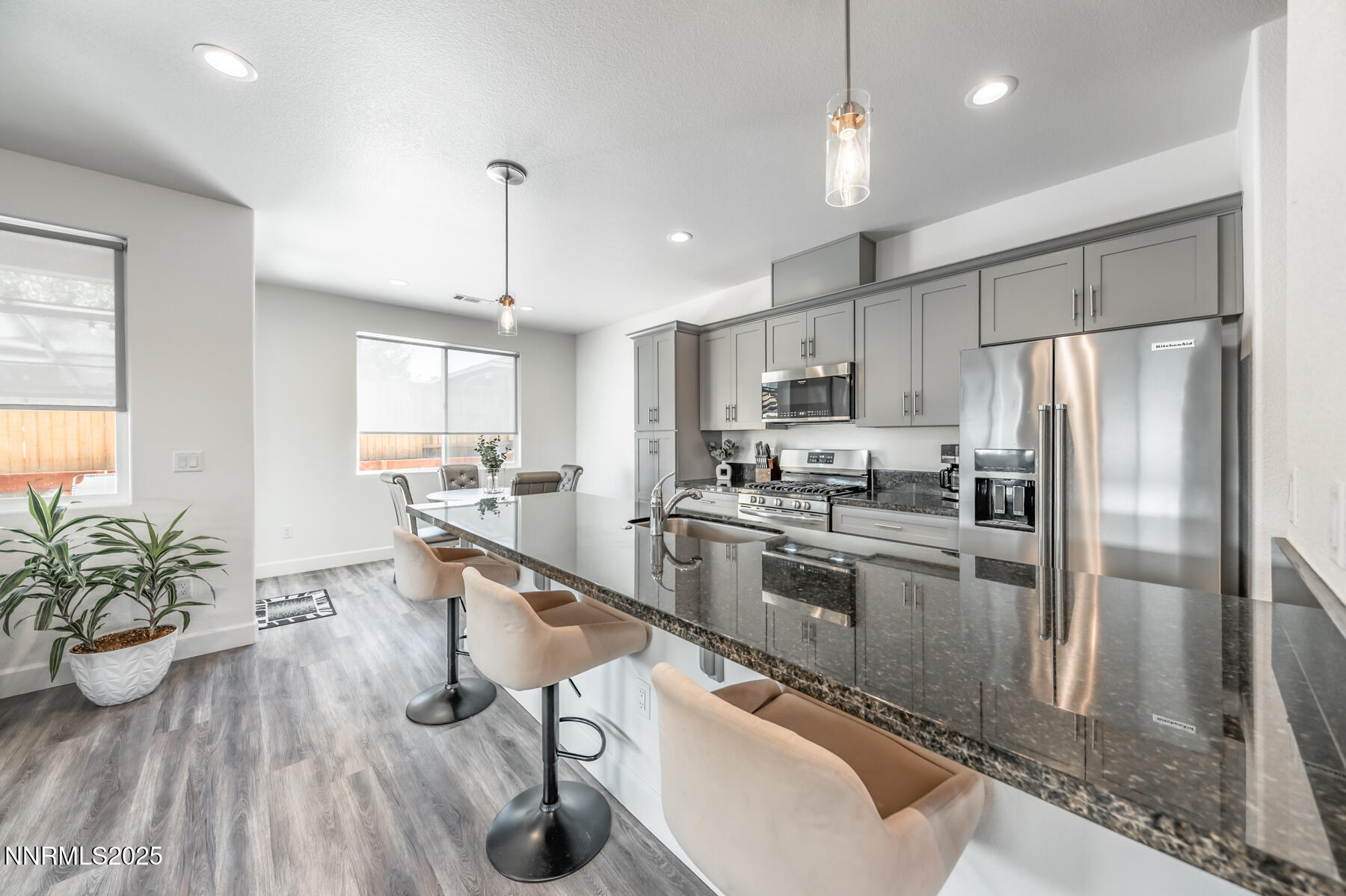 785 Garnet Way Fernley, NV 89408 - Photo 11 of 33 a kitchen with kitchen island a counter top space a sink appliances and cabinets