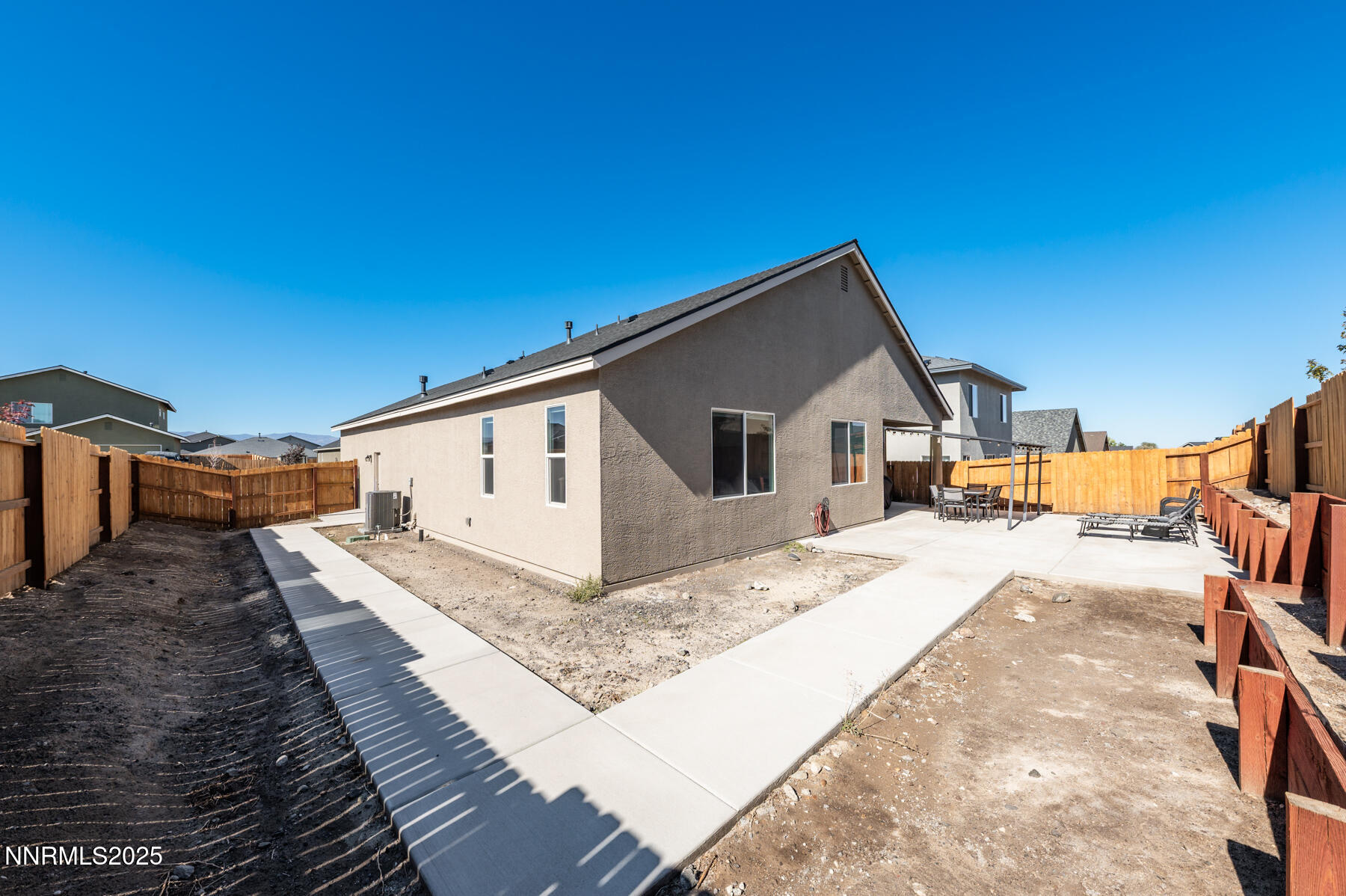 785 Garnet Way Fernley, NV 89408 - Photo 27 of 33 a house view with a backyard space