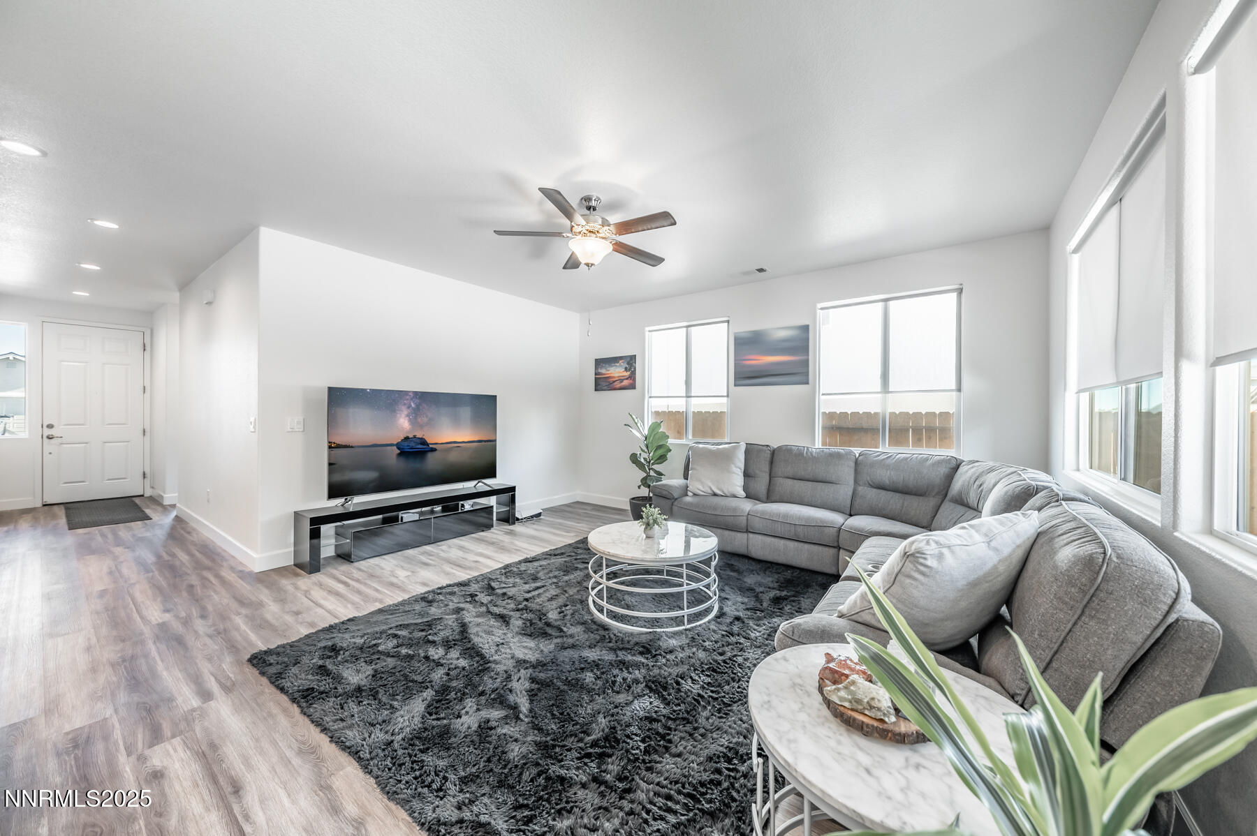 785 Garnet Way Fernley, NV 89408 - Photo 8 of 33 a living room with furniture and a flat screen tv