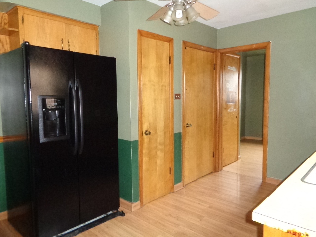 7237 South Ridgeway Avenue Chicago, IL 60629 - Photo 8 of 13 a view of a hallway with wooden floor