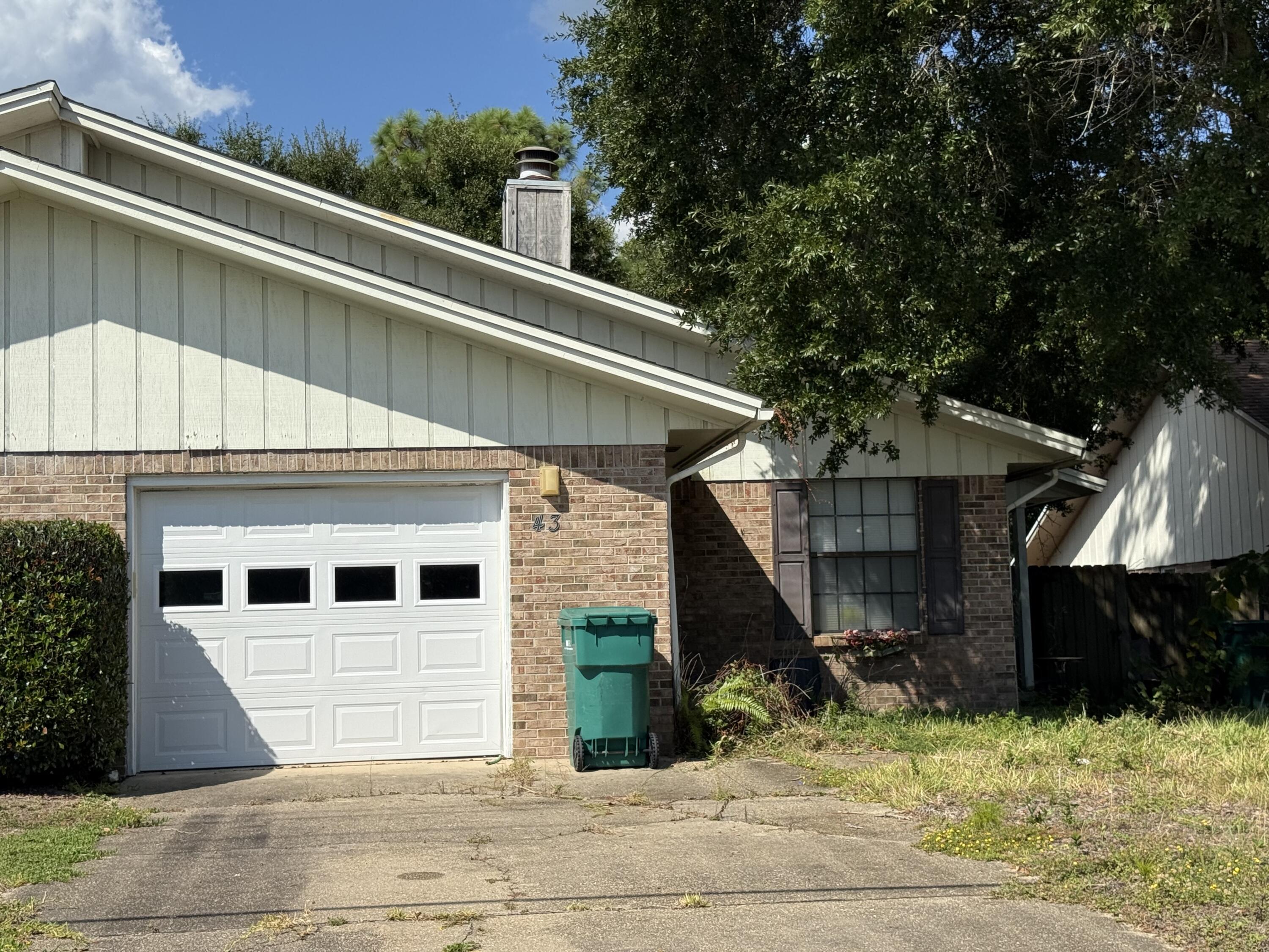 a view of a house with a snow in the yard
