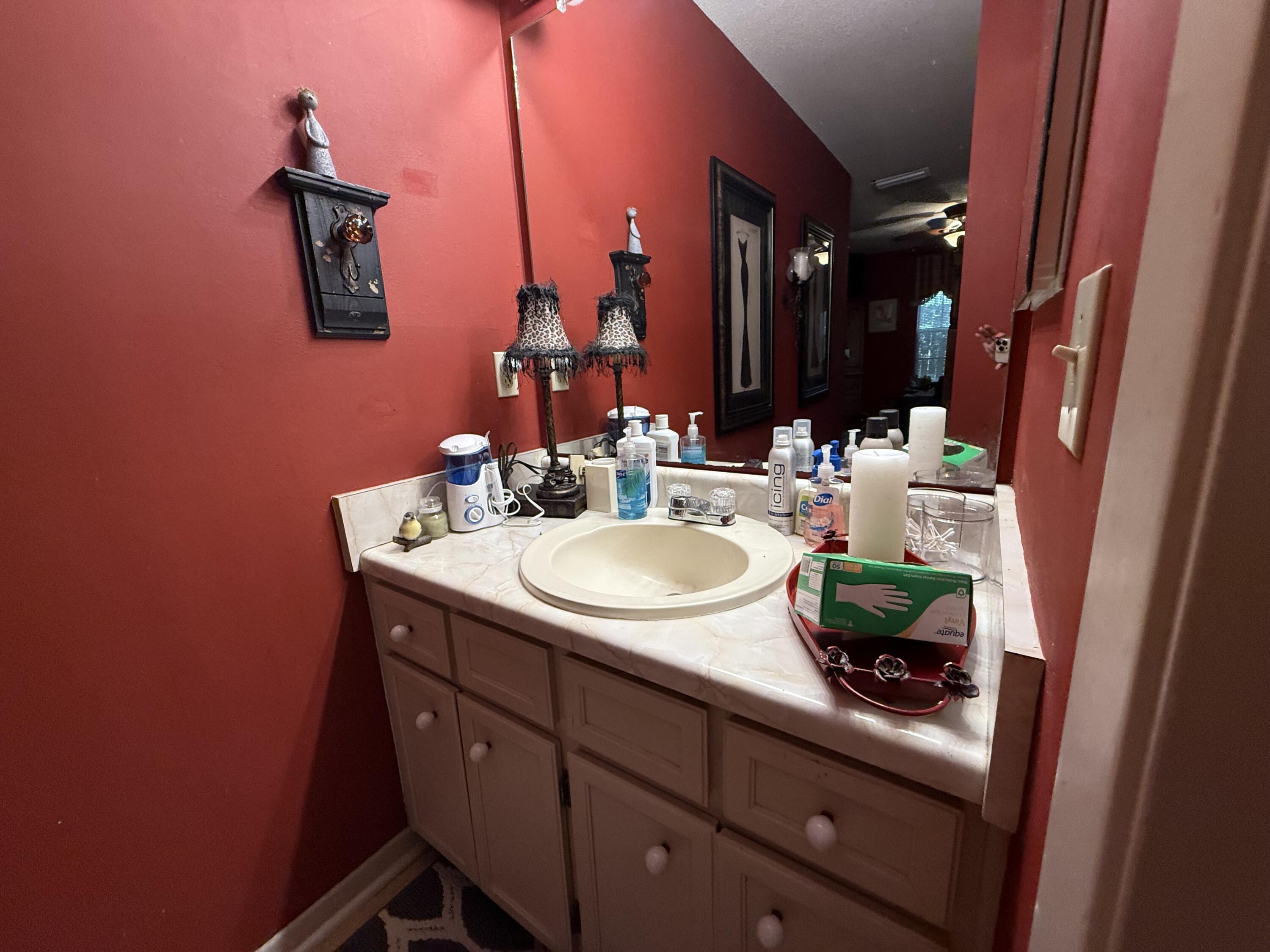 43 12th Avenue Shalimar, FL 32579 - Photo 14 of 17 a bathroom with a sink vanity and mirror