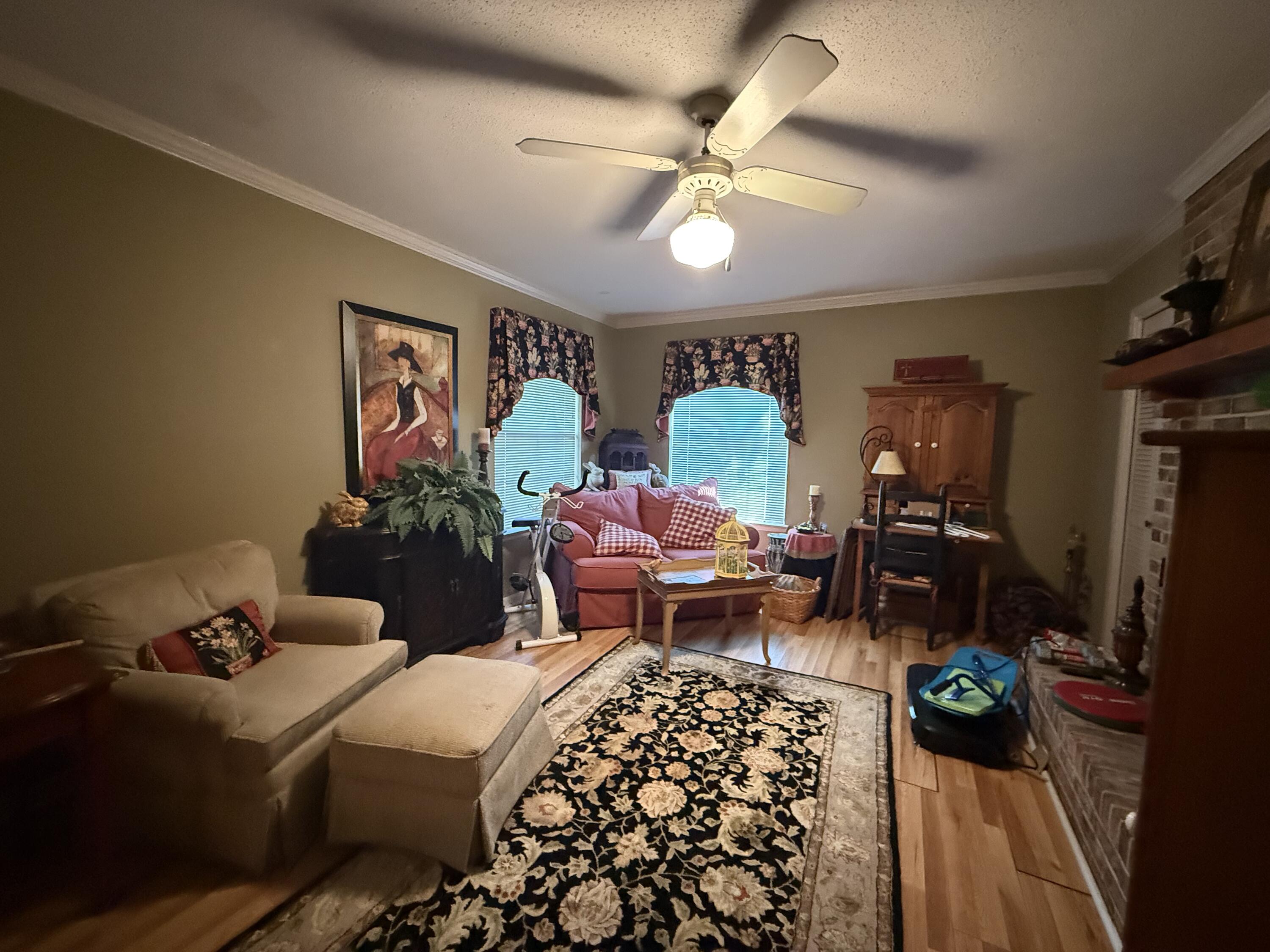 43 12th Avenue Shalimar, FL 32579 - Photo 5 of 17 a bedroom with bed and a chandelier