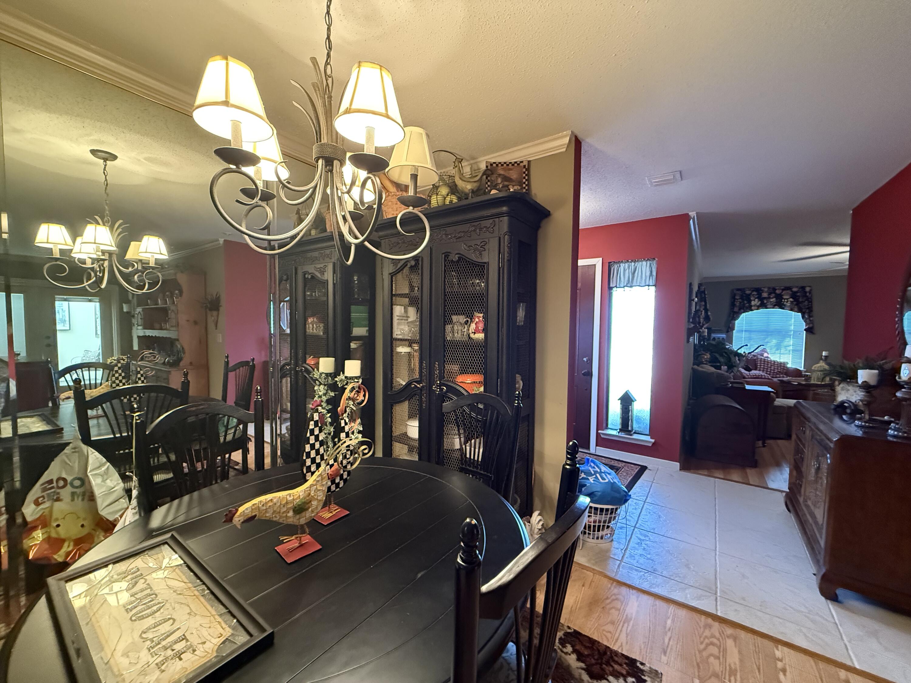 43 12th Avenue Shalimar, FL 32579 - Photo 9 of 17 a view of a dining room with furniture