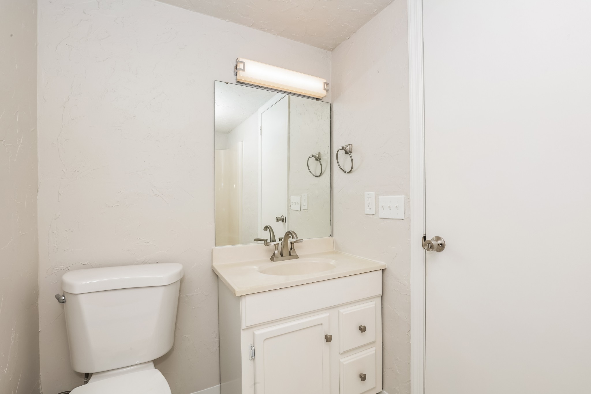 405 Montego Cove Hermitage, TN 37076 - Photo 14 of 16 a bathroom with a toilet sink and mirror