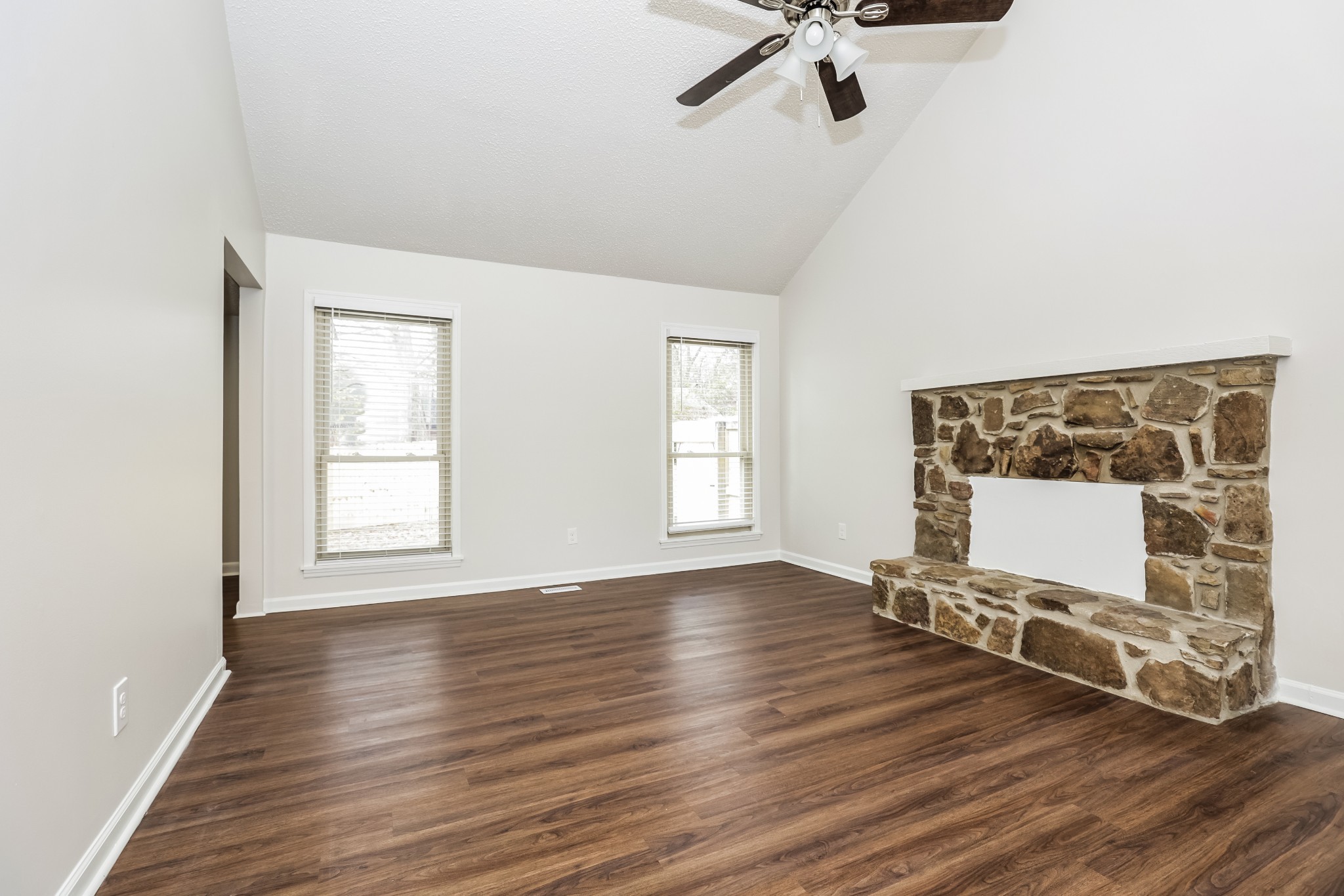 405 Montego Cove Hermitage, TN 37076 - Photo 4 of 16 an empty room with wooden floor and windows