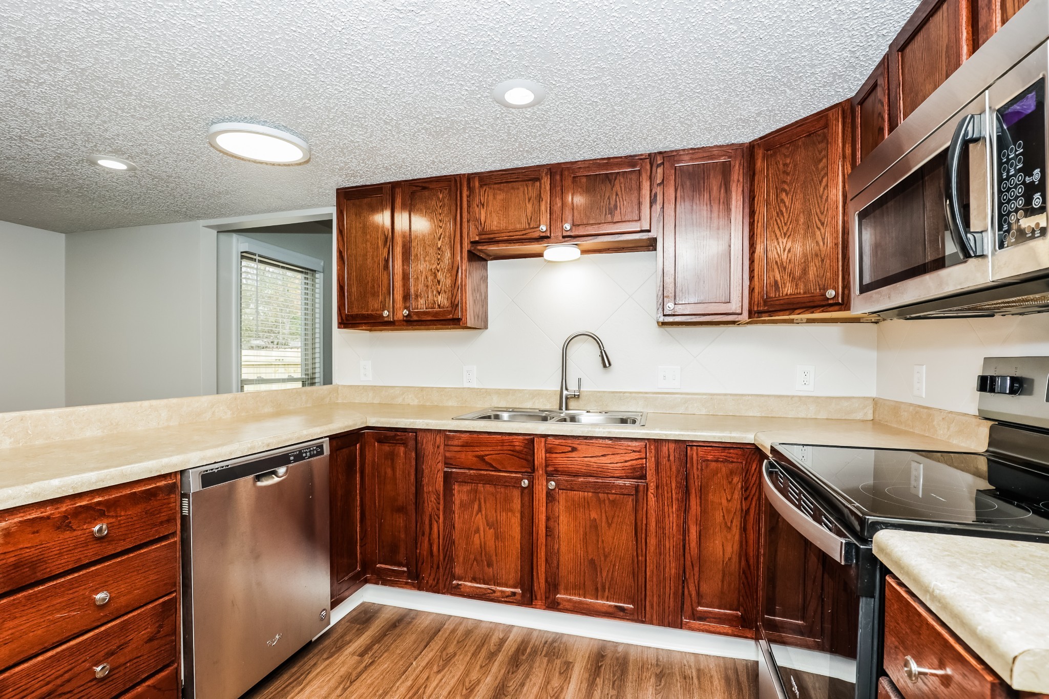 405 Montego Cove Hermitage, TN 37076 - Photo 7 of 16 a kitchen with stainless steel appliances granite countertop a sink stove and cabinets