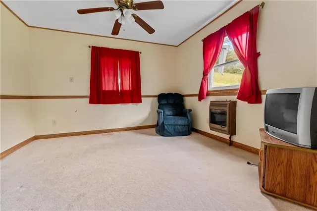 a view of a livingroom with furniture and a kitchen