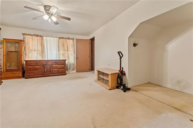a room with gym equipment and windows