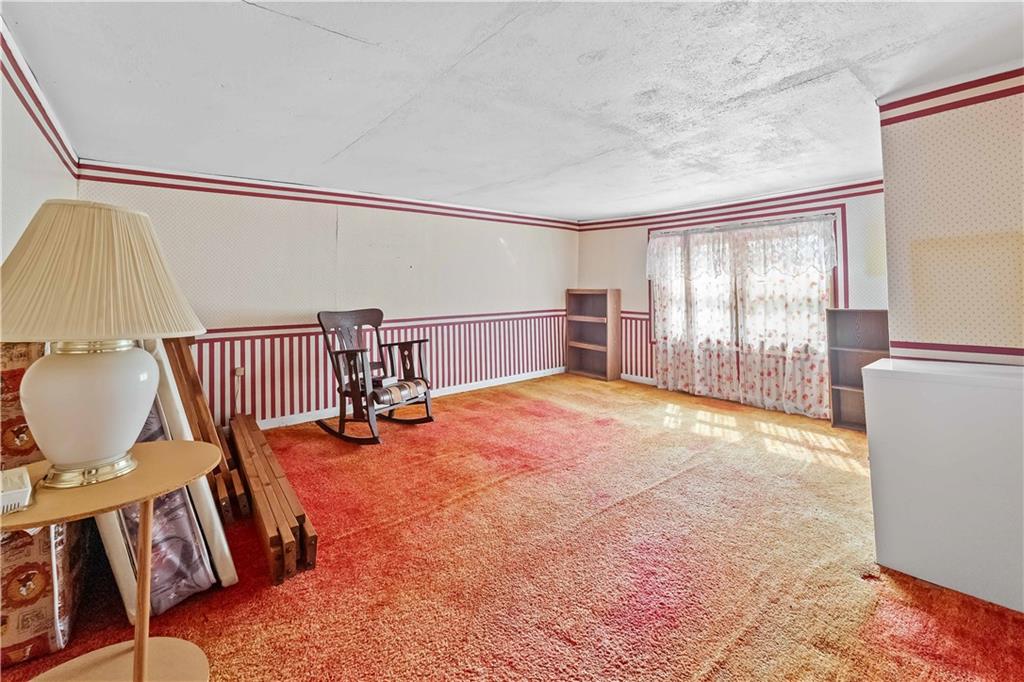 322 Wilson Road Mount Morris, PA 15349 - Photo 20 of 26 a view of a livingroom with furniture wooden floor and windows