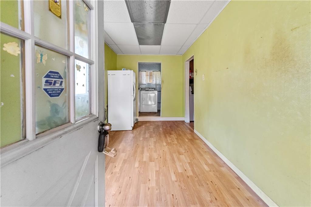 322 Wilson Road Mount Morris, PA 15349 - Photo 26 of 26 a view of a hallway with wooden floor and staircase