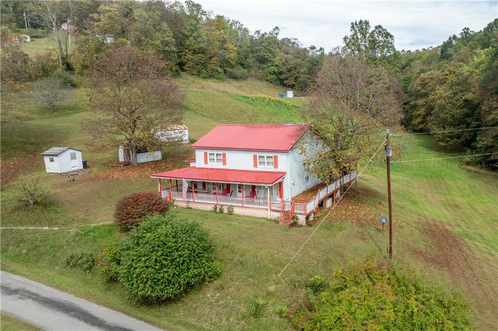322 Wilson Road Mount Morris, PA 15349 - Photo 8 of 26 an aerial view of a houses with swimming pool
