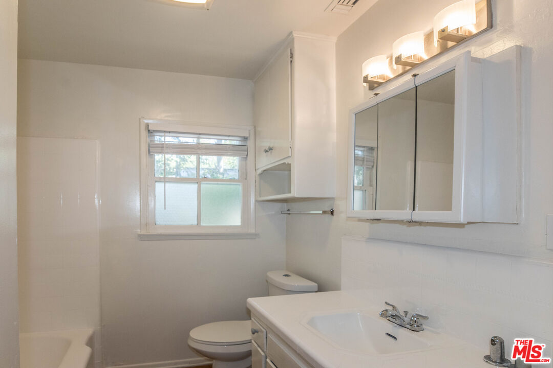 1341 Vienna Way Venice, CA 90291 - Photo 11 of 15 a bathroom with a sink a toilet and shower