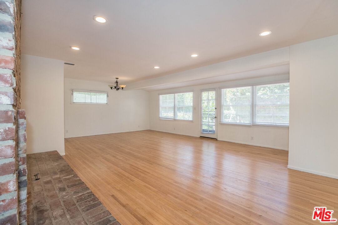 1341 Vienna Way Venice, CA 90291 - Photo 4 of 15 an empty room with wooden floor and windows