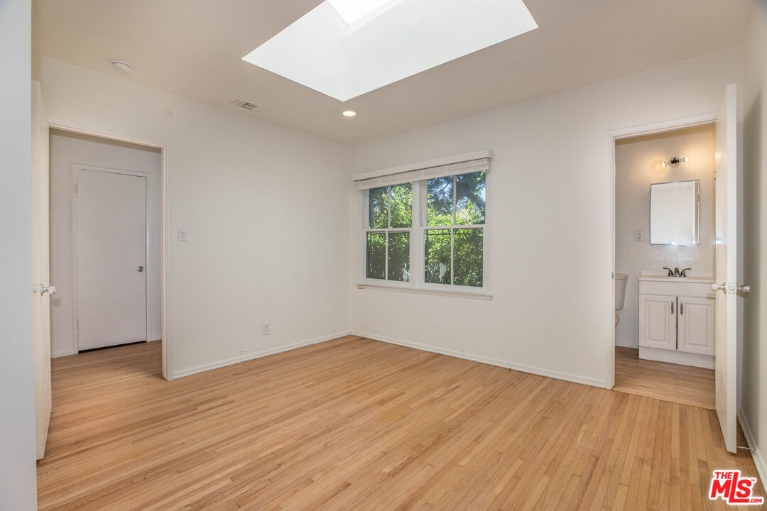 1341 Vienna Way Venice, CA 90291 - Photo 8 of 15 an empty room with wooden floor and windows