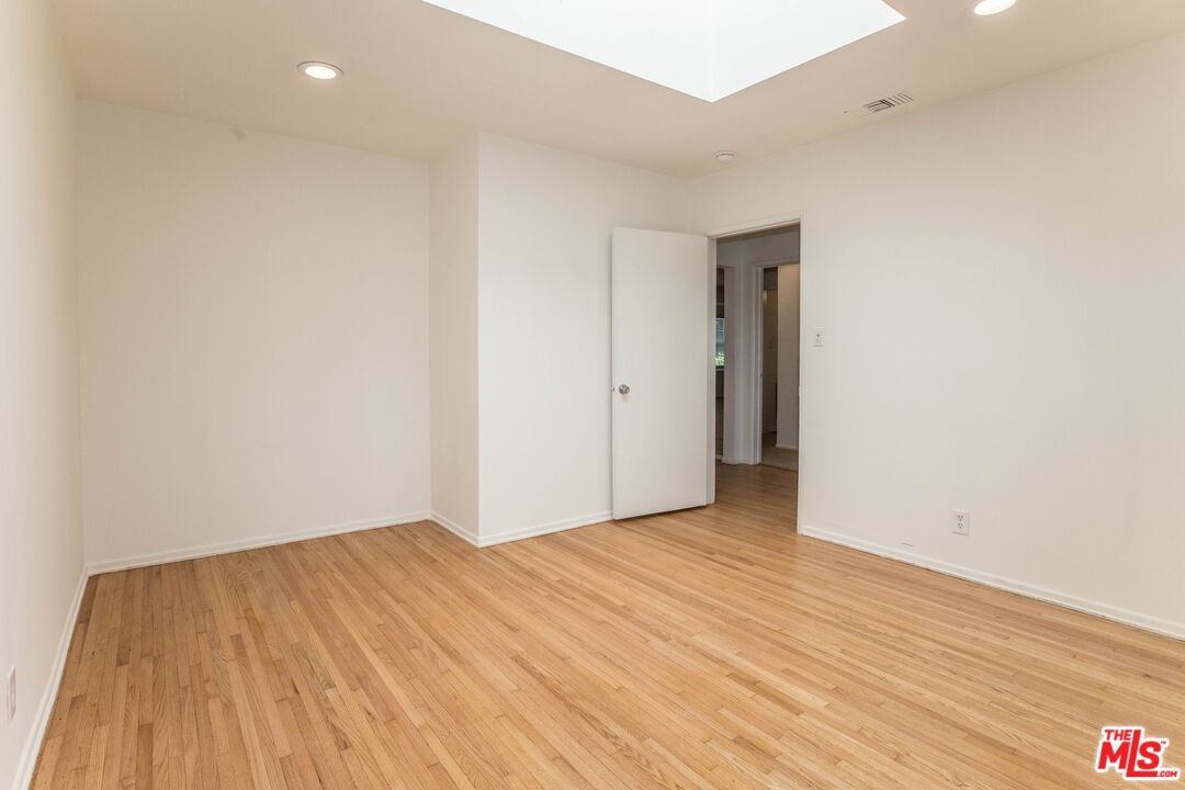 1341 Vienna Way Venice, CA 90291 - Photo 9 of 15 a view of an empty room with wooden floor