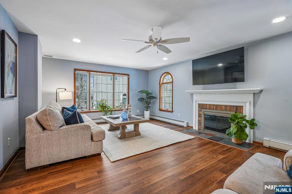 40 Golf Road Bloomfield, NJ 07003 - Photo 18 of 50 a living room with furniture fireplace and a flat screen tv