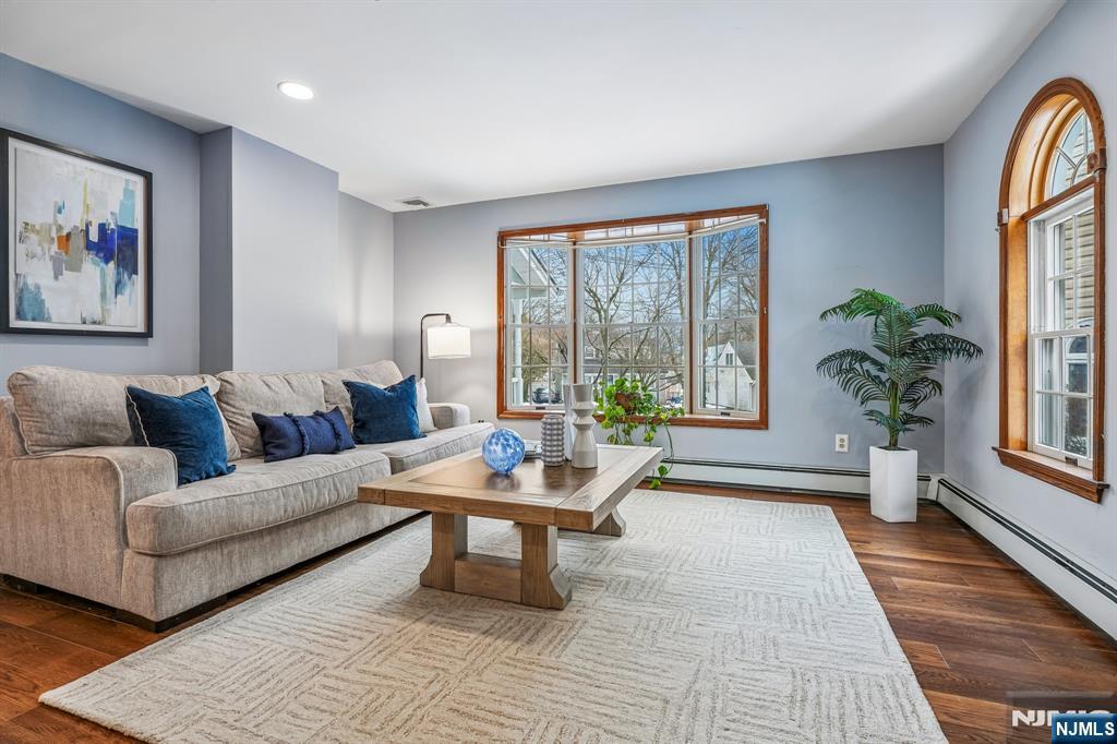 40 Golf Road Bloomfield, NJ 07003 - Photo 19 of 50 a living room with furniture and a large window with wooden floor