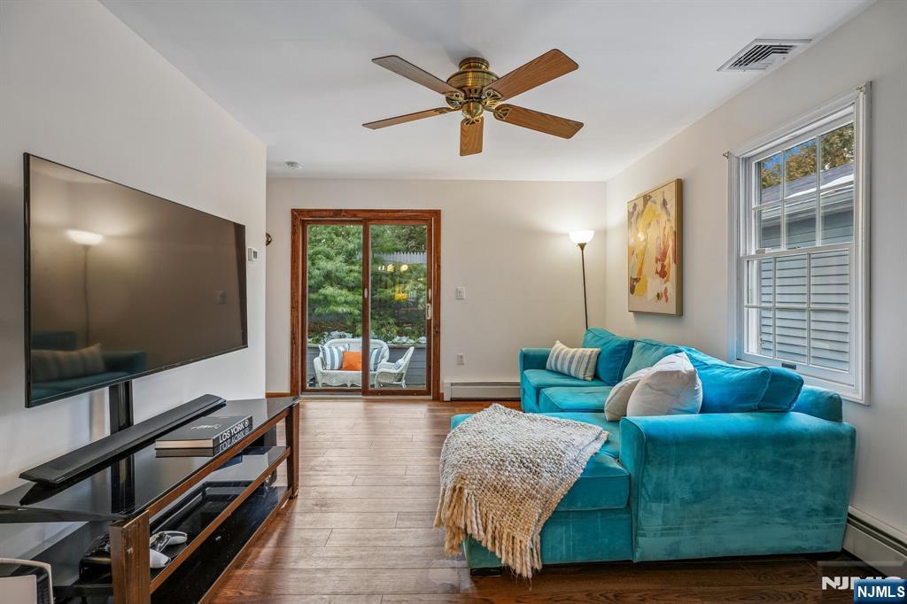 40 Golf Road Bloomfield, NJ 07003 - Photo 21 of 50 a living room with furniture and a flat screen tv